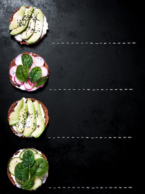 Dish with avocado and radish slices seen from top