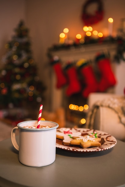 Dish with cookies and cup