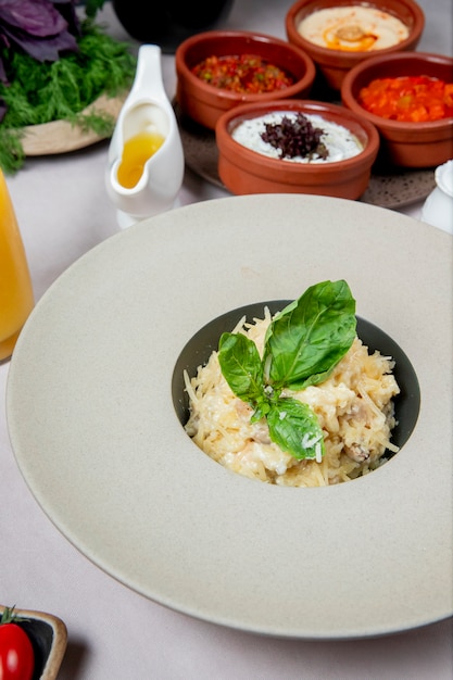 Dish with grated cheese and herbs