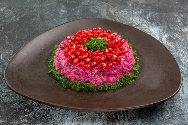 dish with pomegranate sauce and herbs