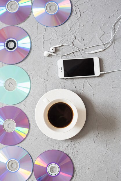 Disks, coffee and smartphone 