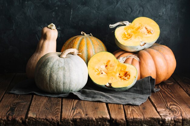 Display of pumpkins and squash on a wooden table