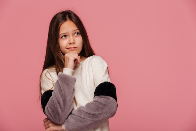 Free photo displeased girl looking up at copy space isolated