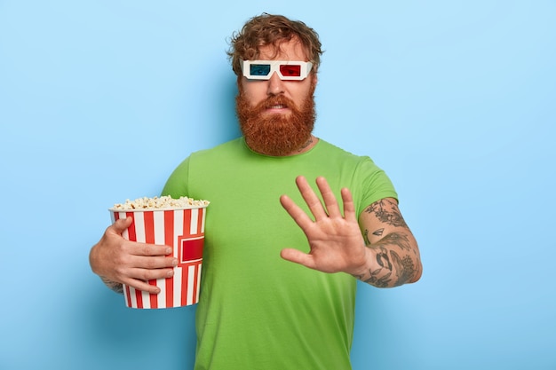 Displeased unhappy ginger guy in cinema refuses talk about film and characters after watching