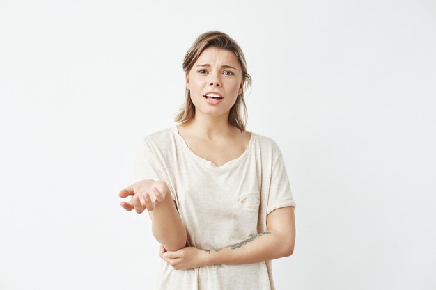 Displeased young girl gesturing speaking .