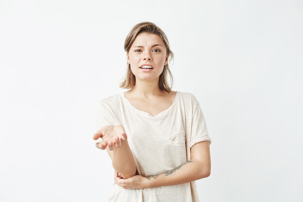 Displeased young girl gesturing speaking .