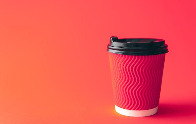 Free photo disposable paper cup in trendy color viva magenta