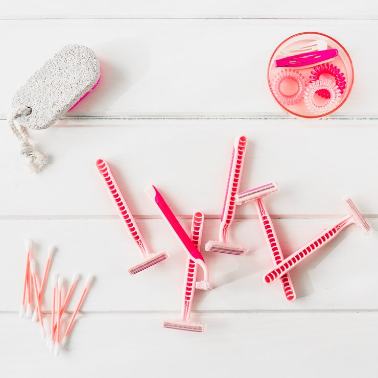 Free Photo disposable razors and pumice near elastics