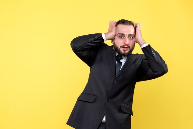 Dissapointed young man holding his hands on his head