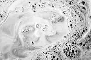 Free photo dissolving bath bomb in the tub water with foam
