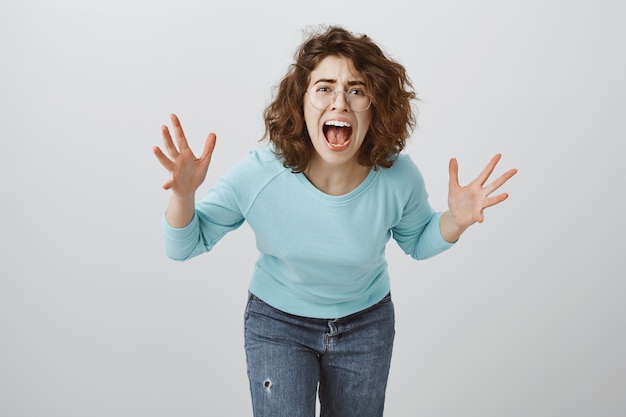 Free photo distressed and mad, heartbroken woman screaming and shaking hands, girl having argument, scolding someone