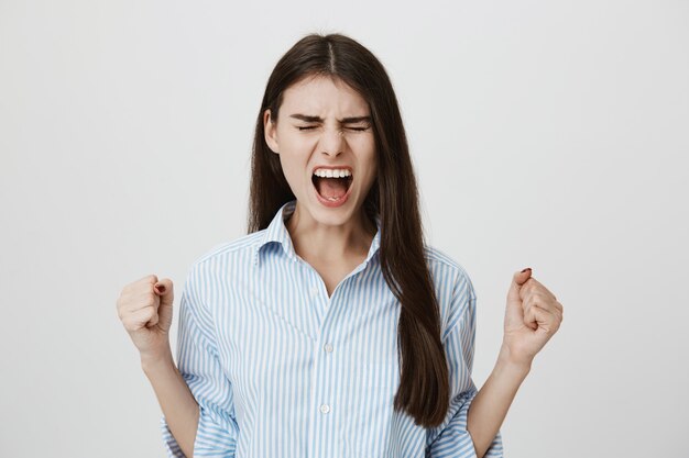 Distressed woman screaming angry