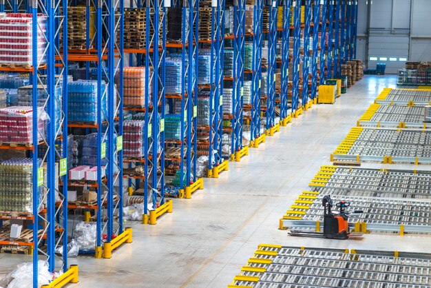 Distribution warehouse building interior and large storage area with goods on the shelf