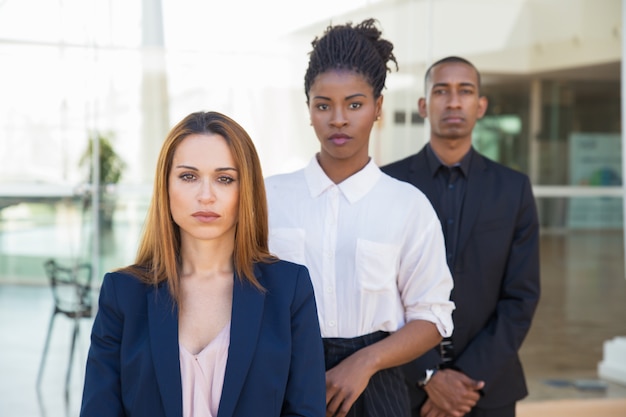 Diverse business colleagues posing in office