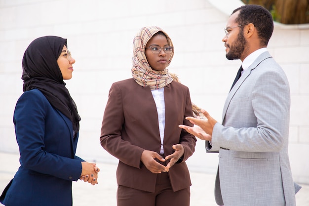 Diverse business group discussing project outside