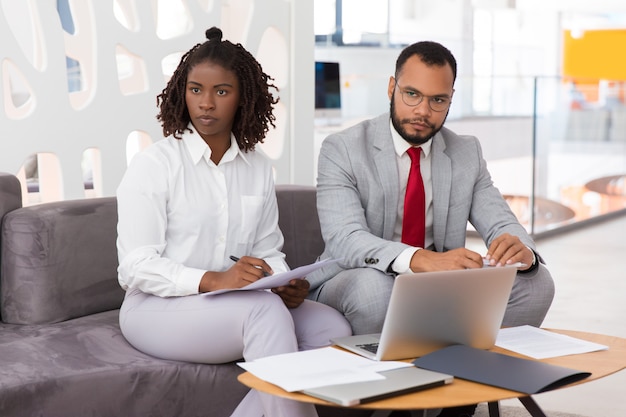 Diverse colleagues working on project together