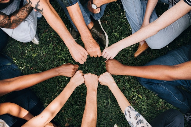 Diverse community with hands in a circle