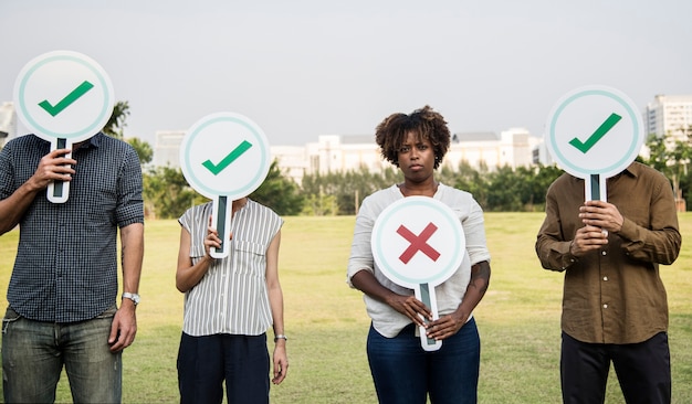 Diverse friends holding checkmark icons