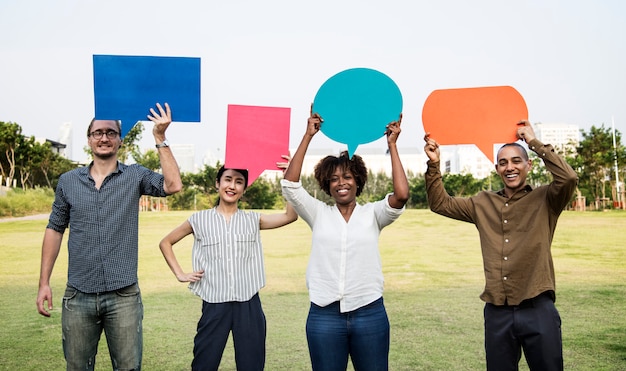 Diverse friends holding speech bubbles