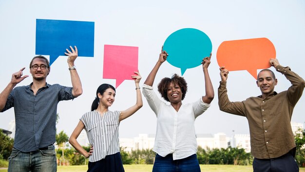 Diverse friends holding speech bubbles