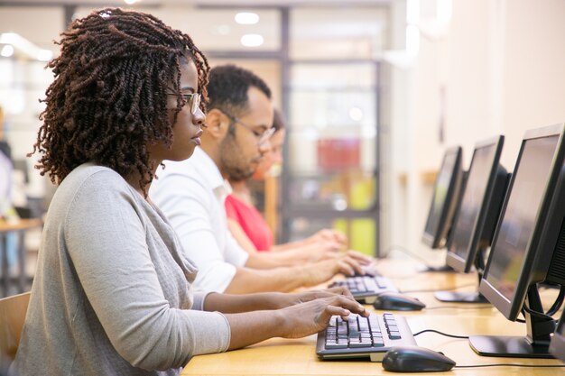 diverse group of employees working on their computers