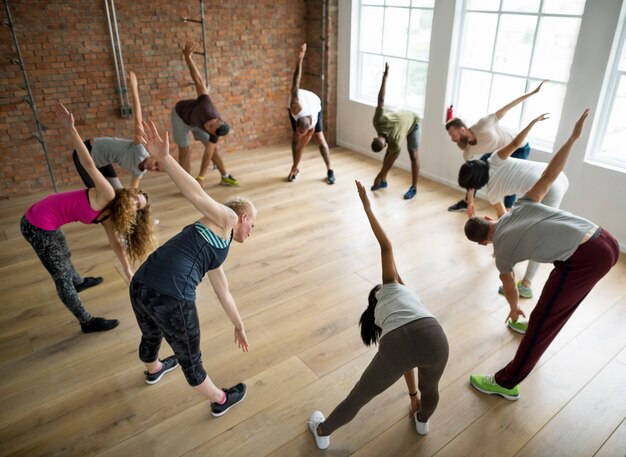 Diverse group of people excercising in a circle