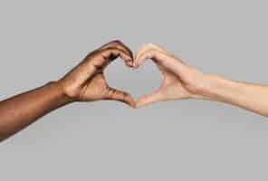 Free photo diverse hands gestured in heart-shape