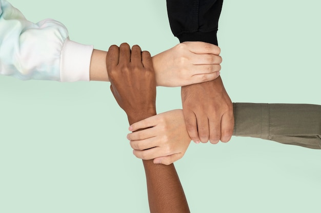 Diverse hands united business teamwork gesture