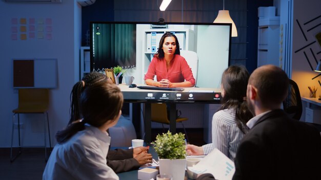 Diverse multiethnic businesspeople discussing management strategy during online videocall