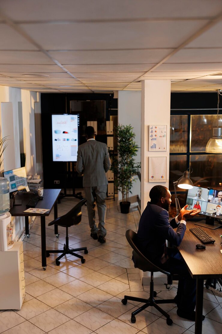 Free Photo diverse people discussing marketing statistics during online videocall meeting conference, working over time at company strategy in startup office. remote employees preparing investment graph