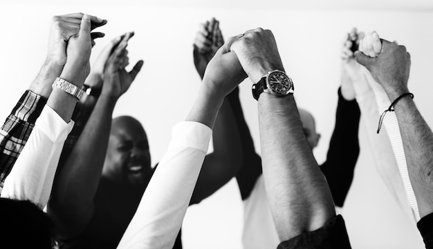 Free photo diverse people joining hands together