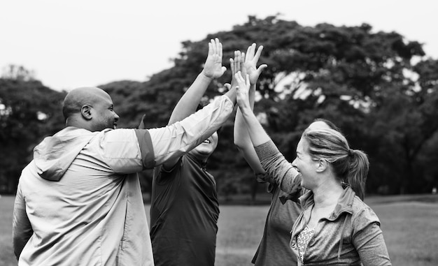 Diverse people making a high five