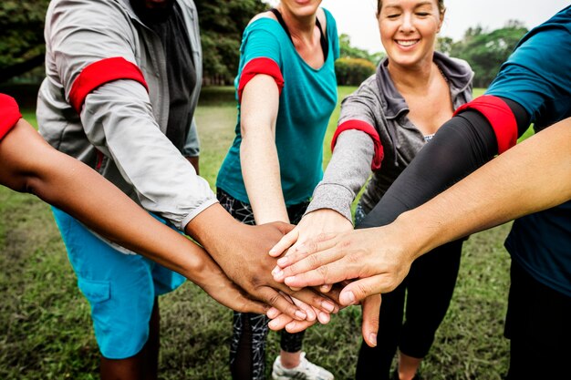 Diverse team stacking their hands