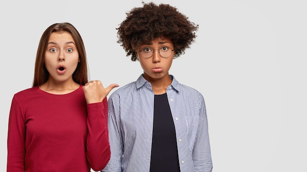 Diverse women express different emotions. Shocked woman in red sweater