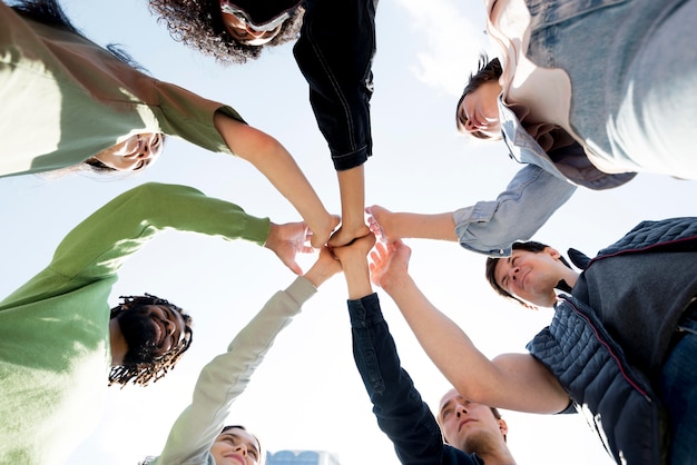 Diversity of people holding hands bottom view