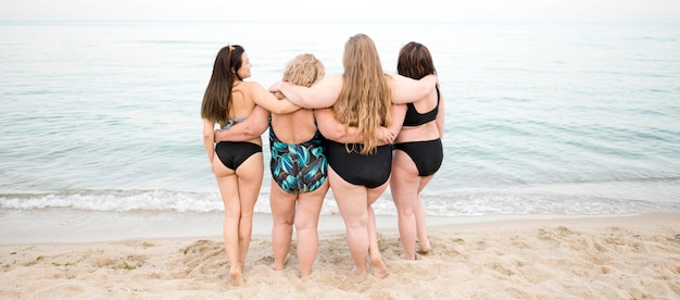 Diversity of women looking at the ocean