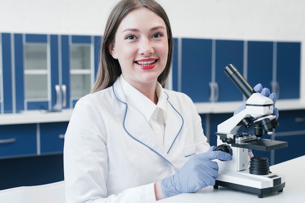 Doctor analyzing with a microscope