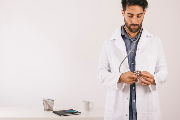 Doctor checking his stethoscope