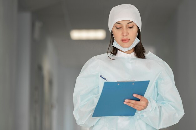 Doctor checking medical form at the hospital