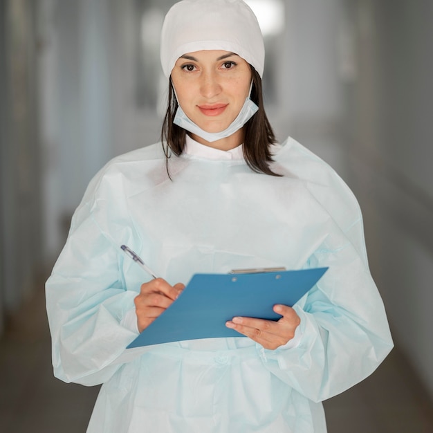 Doctor checking medical form at the hospital