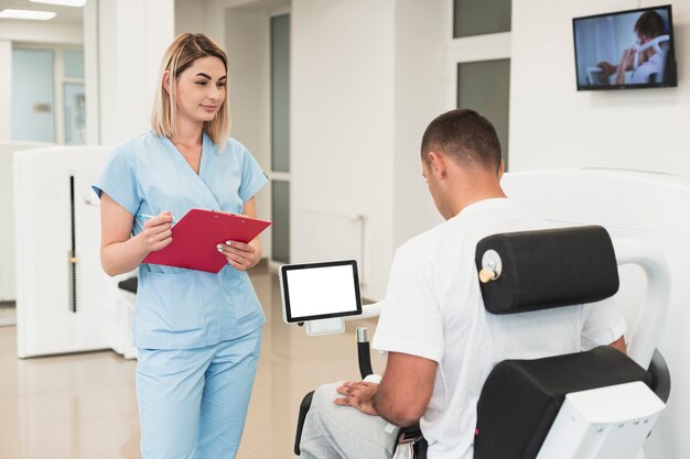 Doctor checking patient doing medical exercises