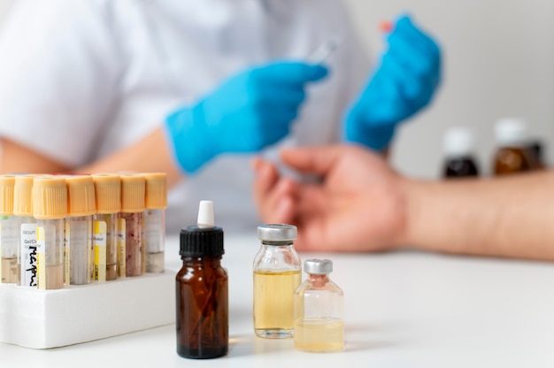 Free photo doctor checking a person's skin allergy