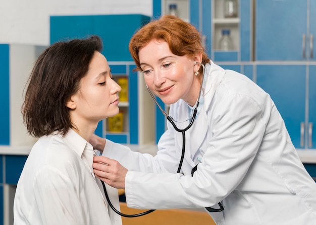 Doctor consulting patient with stethoscope