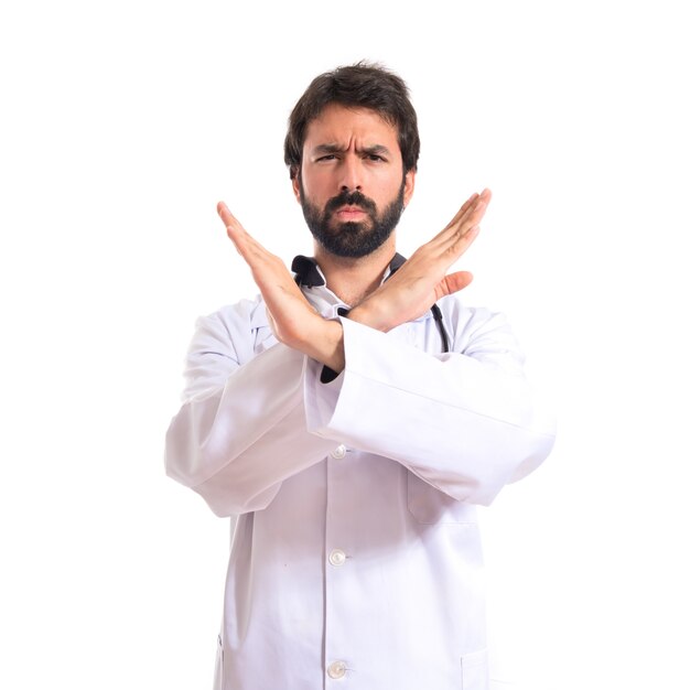 Doctor doing NO gesture over white background