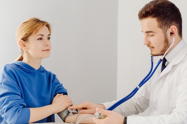 Doctor examines the patient . Medicine and health care concept.