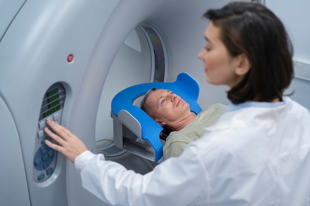 Doctor getting patient ready for ct scan