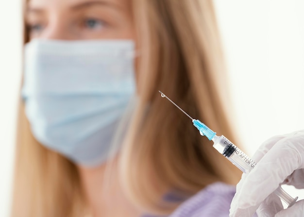 Doctor getting ready a vaccine for a patient