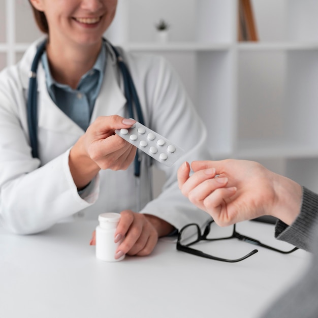 Doctor giving patients medical prescription