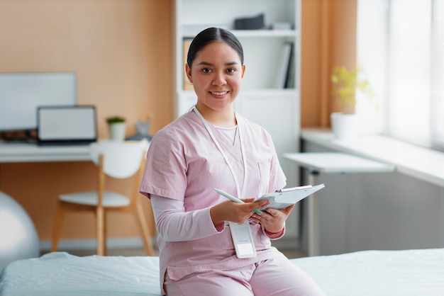 Doctor helping patient during rehabilitation