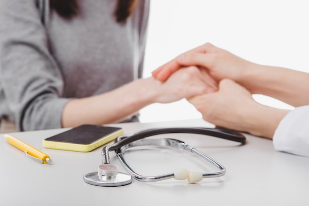 Doctor helping to patient